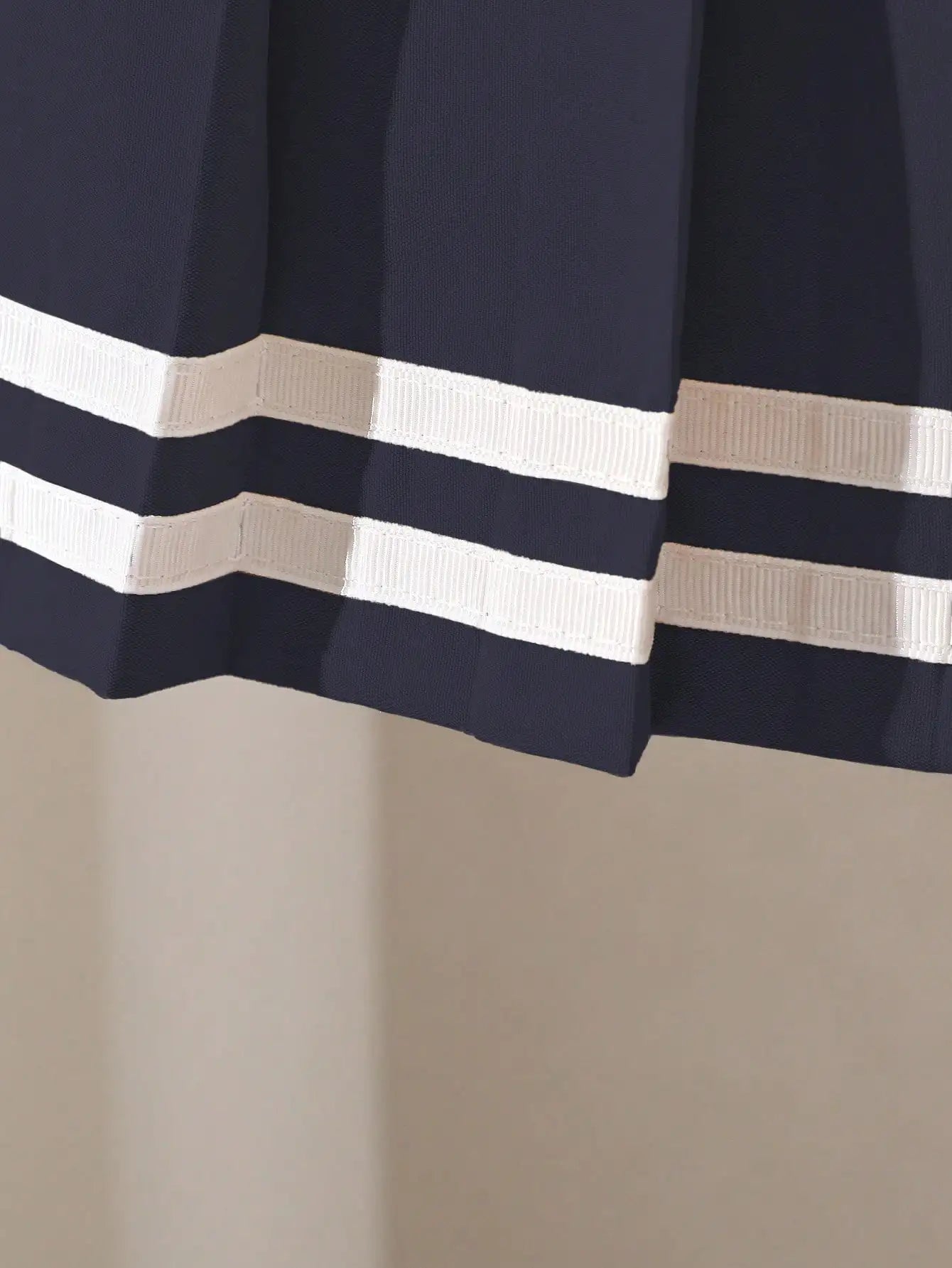 Navy Blue Pleated Skirt for Girls with White Stripe Trim and Elastic Waist
